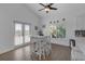A dining area featuring a white table and access to an outdoor area at 6602 S Sherrill St, Tampa, FL 33616