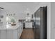 Kitchen with white cabinets, stainless steel appliances, and a large island with bar seating at 6602 S Sherrill St, Tampa, FL 33616