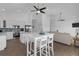 A kitchen featuring white cabinets, stainless steel appliances and an island with seating at 6602 S Sherrill St, Tampa, FL 33616