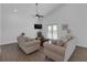 A living room featuring a TV and two sofas facing each other at 6602 S Sherrill St, Tampa, FL 33616