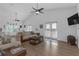 Bright living room with a high ceiling, modern fans, and comfortable seating at 6602 S Sherrill St, Tampa, FL 33616