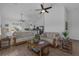 Spacious living area with vaulted ceiling, ceiling fans, and open access to the kitchen area at 6602 S Sherrill St, Tampa, FL 33616