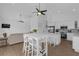 Open living space includes a modern kitchen and dining area, perfect for entertaining at 6602 S Sherrill St, Tampa, FL 33616