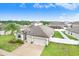 Aerial view of a single Gathering home, showcasing the landscaped yard and two car garage at 6620 Paden Wheel St, Zephyrhills, FL 33541