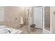 Spa bathroom with a glass-enclosed shower, soaking tub, neutral tiling and convenient bench seating at 6620 Paden Wheel St, Zephyrhills, FL 33541
