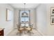 Cozy breakfast nook with a round glass table and decorative pendant lighting at 6620 Paden Wheel St, Zephyrhills, FL 33541