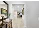 Inviting hallway featuring tiled floors, neutral walls and decorative accents at 6620 Paden Wheel St, Zephyrhills, FL 33541