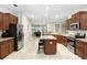 Open kitchen with a granite countertops, stainless steel appliances and center island at 6620 Paden Wheel St, Zephyrhills, FL 33541