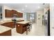 Bright kitchen features granite countertops, stainless steel appliances, and center island at 6620 Paden Wheel St, Zephyrhills, FL 33541