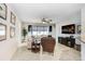 Cozy living room with tile flooring, neutral walls, ceiling fan and large window for ample natural lighting at 6620 Paden Wheel St, Zephyrhills, FL 33541