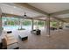Expansive outdoor patio featuring comfortable seating and views of the refreshing community pool at 6620 Paden Wheel St, Zephyrhills, FL 33541
