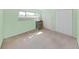 Bedroom with green walls, closet and hard surface flooring at 700 Starkey Rd # 311, Largo, FL 33771