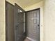 Close up of the front door and entryway featuring an open screen door at 700 Starkey Rd # 311, Largo, FL 33771