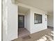 Inviting entryway with a welcome mat, neutral color scheme and an exterior window at 700 Starkey Rd # 311, Largo, FL 33771