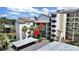 Aerial shot of the condo building with palm trees at 700 Starkey Rd # 311, Largo, FL 33771