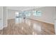 Expansive living room with natural light, wood floors and neutral paint at 700 Starkey Rd # 311, Largo, FL 33771