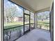 Screened-in patio offering views of the lush lawn and community at 700 Starkey Rd # 311, Largo, FL 33771