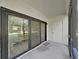 View of the screened patio with large sliding glass doors at 700 Starkey Rd # 311, Largo, FL 33771