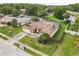 An aerial view capturing the layout of the home, driveway, and surrounding neighborhood at 7018 Arbor View Ln, New Port Richey, FL 34653