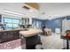Kitchen with a breakfast bar area, tile flooring, and a dining table off to the side at 7018 Arbor View Ln, New Port Richey, FL 34653