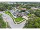 Stunning aerial view showcasing the home's prime location, lush landscaping, screened pool, and well-manicured lawn at 852 Crystal Dr, Palm Harbor, FL 34683