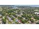 Expansive aerial view of a vibrant neighborhood surrounded by lush greenery and serene water views at 852 Crystal Dr, Palm Harbor, FL 34683