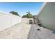 Spacious backyard features white gravel, providing a versatile outdoor area perfect for relaxation and entertainment at 852 Crystal Dr, Palm Harbor, FL 34683