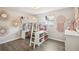 Charming bedroom featuring a loft bed with a built-in desk and stylish decor at 852 Crystal Dr, Palm Harbor, FL 34683