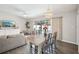 Open dining and living space with pool view, modern appliances, and stylish modern decor at 852 Crystal Dr, Palm Harbor, FL 34683