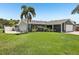 Lush, green lawn with a privacy fence at 852 Crystal Dr, Palm Harbor, FL 34683