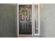 Charming black front door with a wreath at 852 Crystal Dr, Palm Harbor, FL 34683