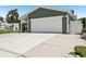 Attached garage with a wide driveway at 852 Crystal Dr, Palm Harbor, FL 34683