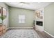 Inviting living room with decorative fireplace, ceiling fan, wood-look flooring, and natural light at 852 Crystal Dr, Palm Harbor, FL 34683