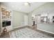 Open-concept living room featuring fireplace, updated kitchen with stainless steel appliances, and modern flooring at 852 Crystal Dr, Palm Harbor, FL 34683