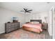 Charming main bedroom with ceiling fan, neutral walls, a decorative rug, and ample space at 852 Crystal Dr, Palm Harbor, FL 34683