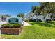 Seminole Garden Apartments featuring a well manicured lawn and mature trees at 8584 111Th St # 308, Seminole, FL 33772