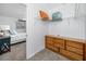 Bedroom featuring a walk in closet and view into the primary bedroom at 8584 111Th St # 308, Seminole, FL 33772