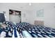 Bedroom featuring two beds with themed bedding, dresser, closet, and a ceiling fan for comfort at 8584 111Th St # 308, Seminole, FL 33772