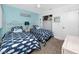 Welcoming bedroom with two twin beds and a beach-themed decor at 8584 111Th St # 308, Seminole, FL 33772