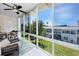 The enclosed lanai offers views of the outdoors and comfortable seating at 8584 111Th St # 308, Seminole, FL 33772