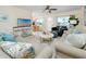 Bright living room with tile floors, ceiling fan, stylish furniture, and plenty of natural light at 8584 111Th St # 308, Seminole, FL 33772