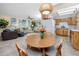 Open concept living space with updated kitchen, dining area, and cozy living room at 8584 111Th St # 308, Seminole, FL 33772