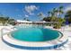 Beautiful large pool area lined with palm trees and plenty of lounge seating for relaxation at 8584 111Th St # 308, Seminole, FL 33772