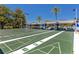Shuffleboard courts with covered seating and landscaping in a community setting at 8584 111Th St # 308, Seminole, FL 33772