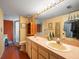 Bathroom featuring a double sink vanity with ample counter space and a walk-in shower at 8731 Huntfield St, Tampa, FL 33635