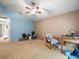 Bedroom with carpet flooring, ceiling fan, and ample space at 8731 Huntfield St, Tampa, FL 33635