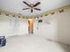 Bedroom featuring neutral walls, ceiling fan, carpet, and closet at 8731 Huntfield St, Tampa, FL 33635