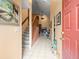 Inviting foyer with tiled floors, staircase, and a view into the living area at 8731 Huntfield St, Tampa, FL 33635