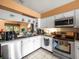 Kitchen area featuring a stainless steel dishwasher and practical appliances at 8731 Huntfield St, Tampa, FL 33635