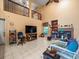 Open living space with soaring ceilings and a cozy fireplace at 8731 Huntfield St, Tampa, FL 33635